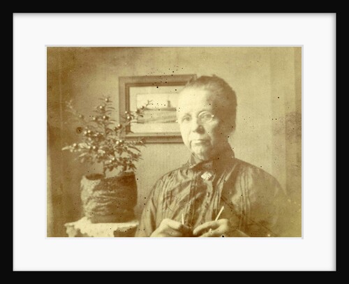 Portrait of an old lady with glasses in a living room by Anonymous