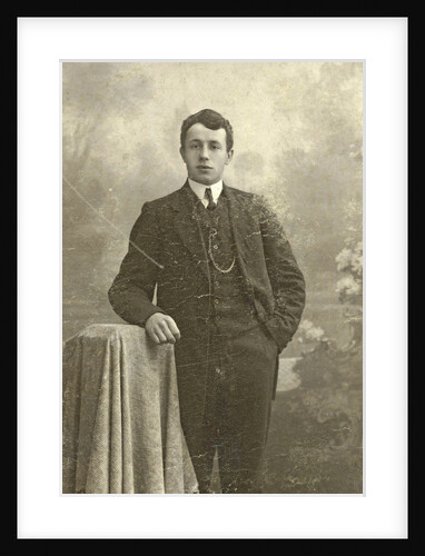 Studio Portrait of a young man standing by Jacobus Vetter