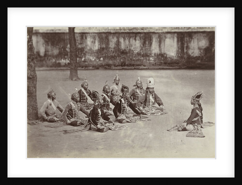 Javanese men sitting on the ground in a craton, Indonesia by Anonymous