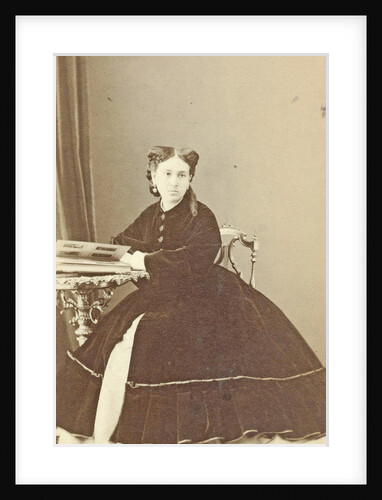 Portrait woman at table with photo album by Alexandre Ken