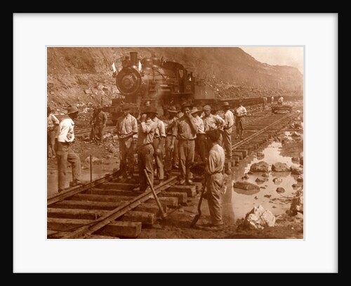 Spanish laborers at work in Culebra Cut and loaded train hauling dirt from canal, USA by Anonymous