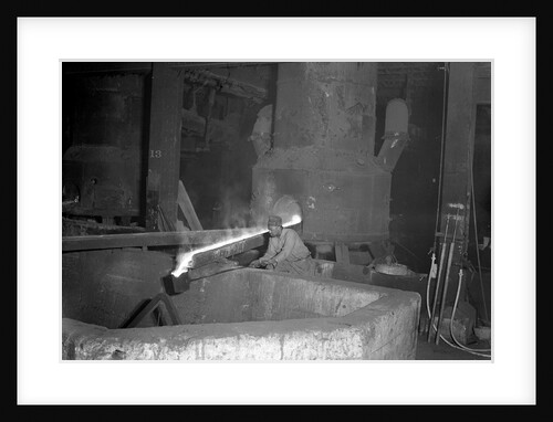 Eddystone, Pennsylvania - Railroad parts. Moulder takes a small pot of metal from tapped furnace to use on a small job, 1936 by Lewis Hine