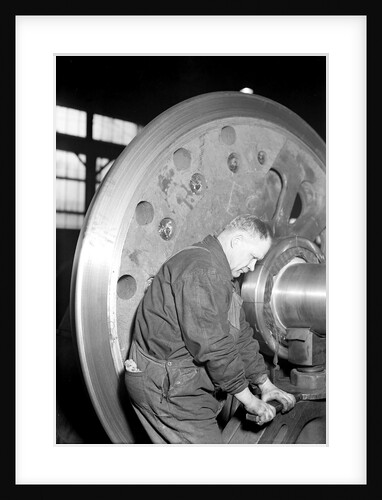 Eddystone, Pennsylvania - Railroad parts. Machinist finishing axle on large driving wheels on newest type of locomotive, March 1937 by Lewis Hine