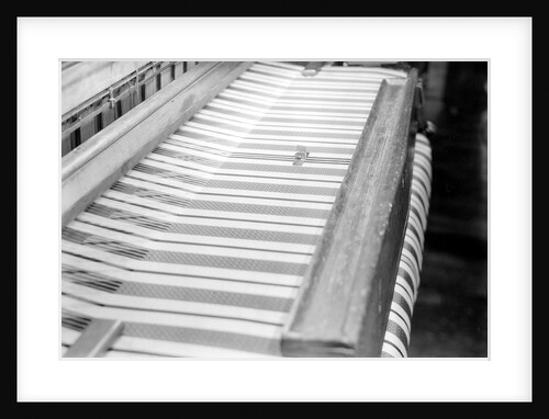 Paterson, New Jersey - Textiles. Wishnack Silk Company. Picture of a knife cutting a novelty. by Lewis Hine