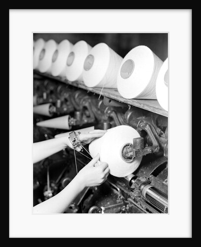 High Point, North Carolina - Textiles. Pickett Yarn Mill. Winder operator by Lewis Hine