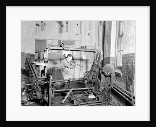 Paterson, New Jersey - Textiles. Junkies breaking up old looms, to be sold for scrap-iron and said to be sent to Japan for munitions, 1936 by Lewis Hine