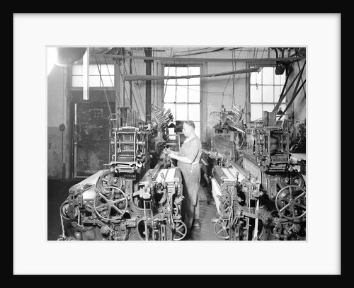 Paterson, New Jersey - Textiles. Weaver operating four-loom system. He is shown removing a used-up quill from the shuttle, 1936 by Lewis Hine