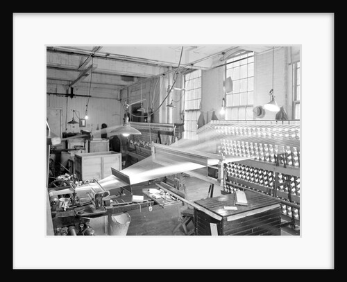 Paterson, New Jersey - Textiles. View of threads going from creel throug the reeds and over the roller. by Lewis Hine
