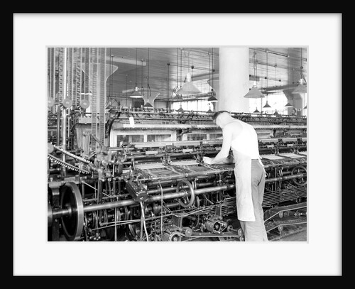 Philadelphia, Pennsylvania - Hosiery. Minnesac Mills. Man working over long row of machines, 1936 by Lewis Hine