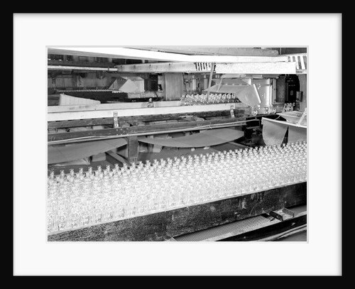 Millville, New Jersey - Glass bottles. Numerous bottles in foreground and bottles on a conveyor belt, 1936 by Lewis Hine