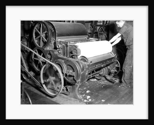Millville, New Jersey - Textiles. Millville Manufacturing Co. Man rolling fabric, 1936 by Lewis Hine