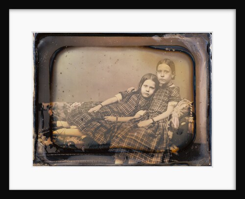 Portrait of two girls reclining on chaise lounge by Sheldon K. Nichols