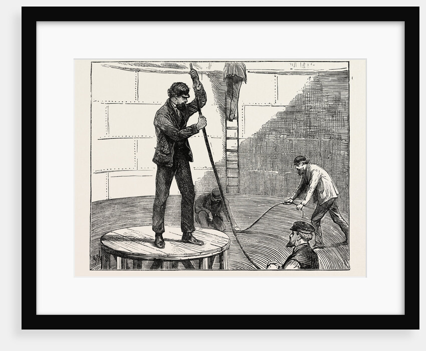 Manufacturing an Electric Telegraph Cable: Coiling Down the Cable in the Tank, 1873 by Anonymous