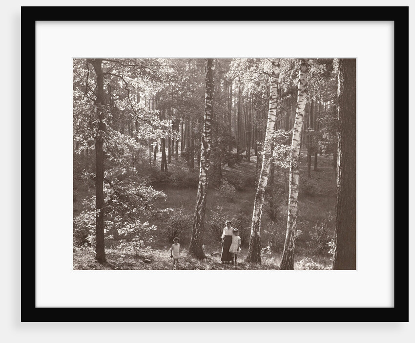 Olga Marba and Eckart Titzenthaler, wife and children of the photographer, standing in a forest by Waldemar Titzenthaler