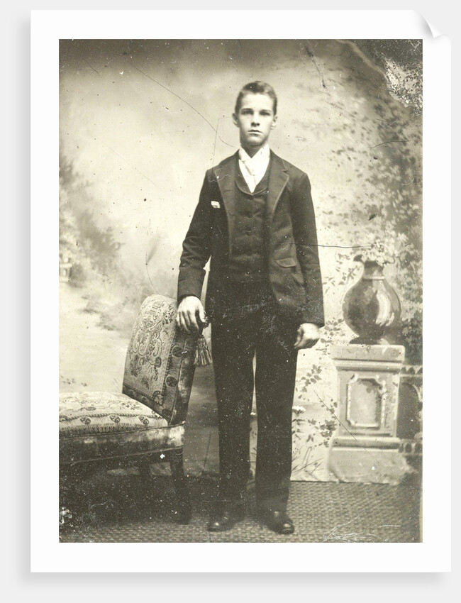 Portrait of a young man standing in front of a painted backdrop, balustrade with vase by Anonymous