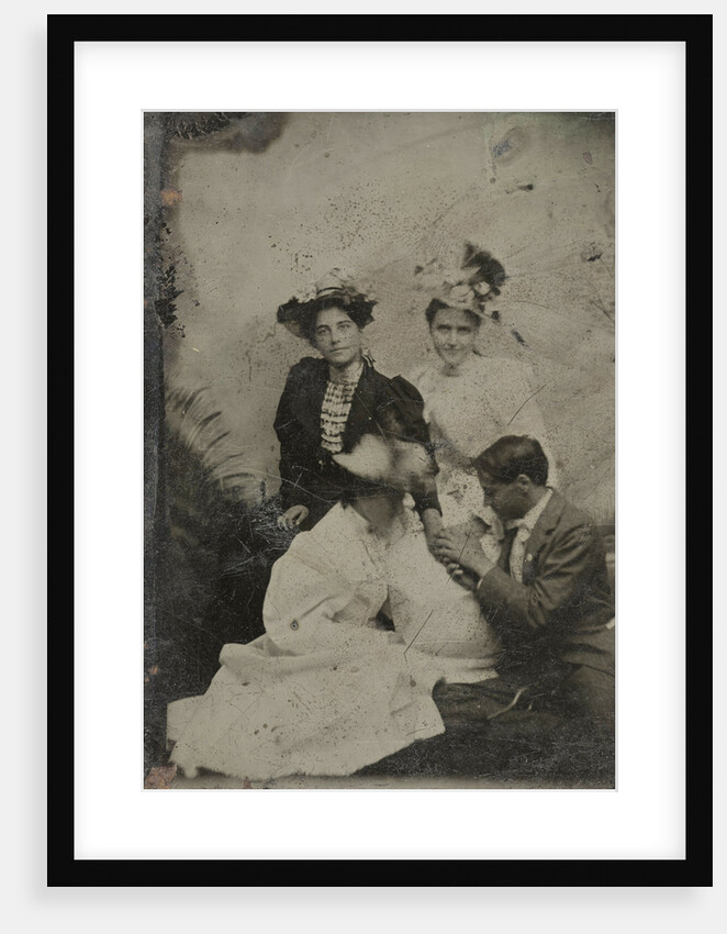 Portrait of a man who is kneeling in three women and two of them holding a hand by Anonymous