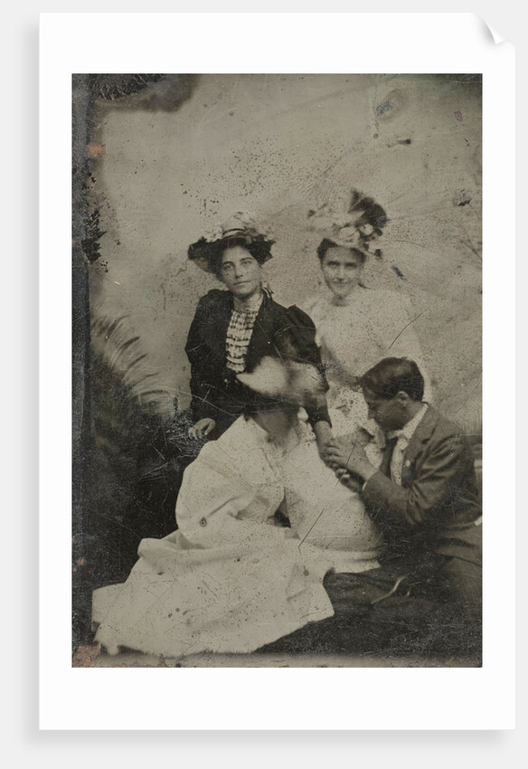 Portrait of a man who is kneeling in three women and two of them holding a hand by Anonymous