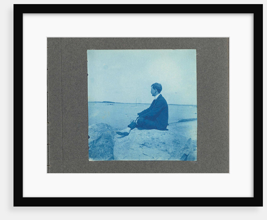 Man in profile, sitting on a rock by the sea, United States, Cyanotype, a photographic printing process that produces a cyan-blue print by Anonymous