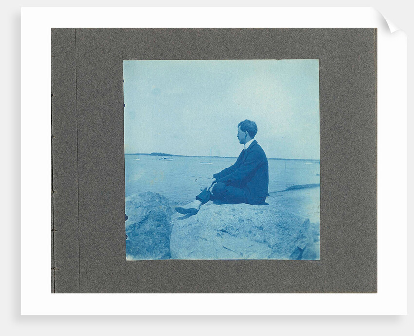 Man in profile, sitting on a rock by the sea, United States, Cyanotype, a photographic printing process that produces a cyan-blue print by Anonymous
