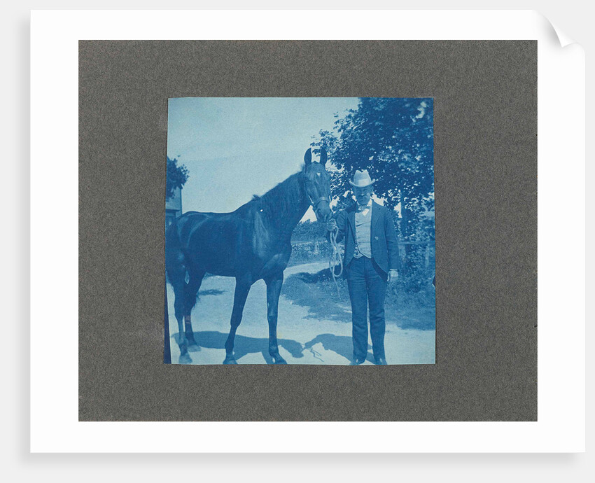 Man holds horse by the reins, United States, USA by Anonymous