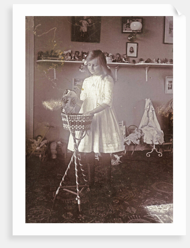 Portrait of Sacha, the eldest daughter of the photographer, in a room with toys by Henry Pauw van Wieldrecht