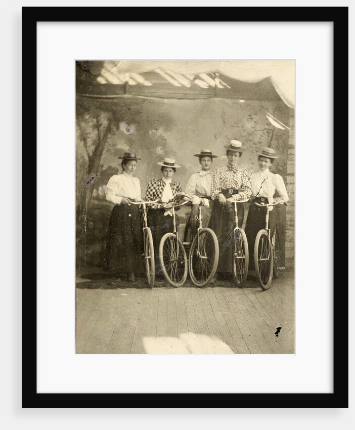 Group portrait of five women with bikes for a painted backdrop with forest by Anonymous