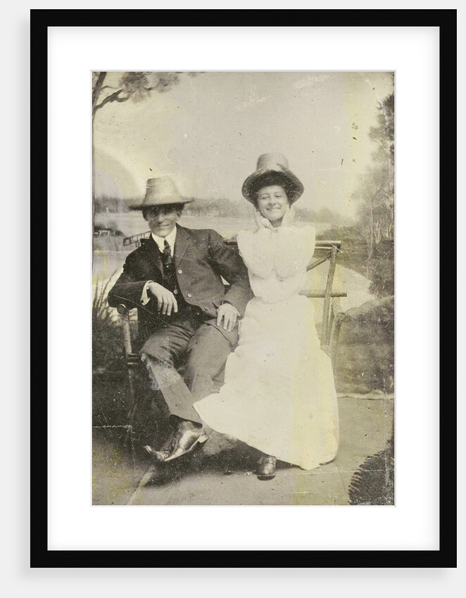 Portrait of a man and woman (Chas and Bo), sitting in front of a painted backdrop (with more trees, Puddin Bay) by Anonymous