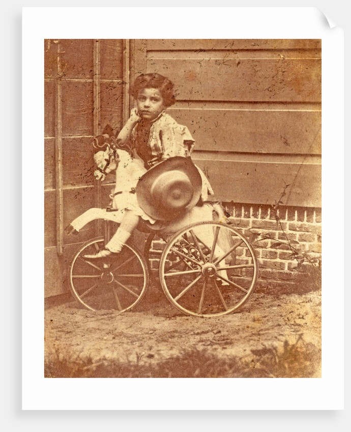 Louis Asser, son of the photographer, on a tricycle by Eduard Isaac Asser