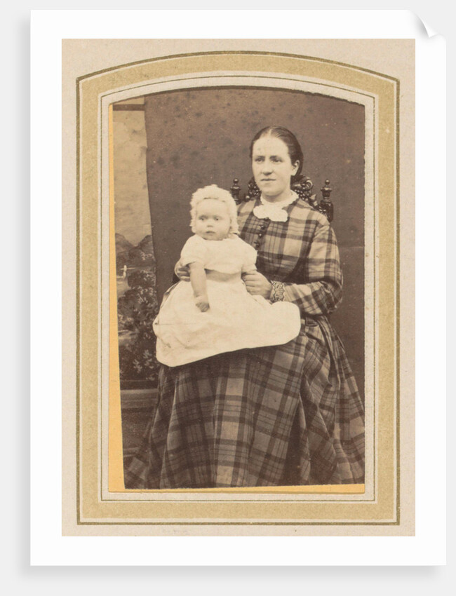 Portrait of a woman in a plaid dress with a baby on lap by E. Steffen