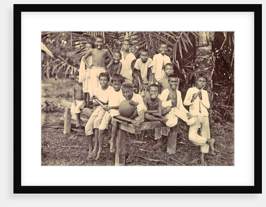 Laughing children with flute, ball and bicycle in Ambon, Indonesia by Anonymous