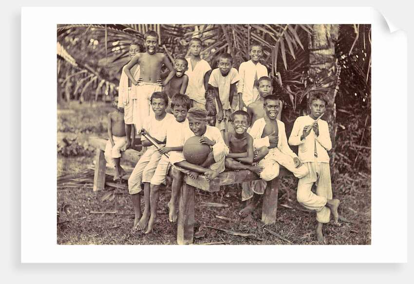 Laughing children with flute, ball and bicycle in Ambon, Indonesia by Anonymous