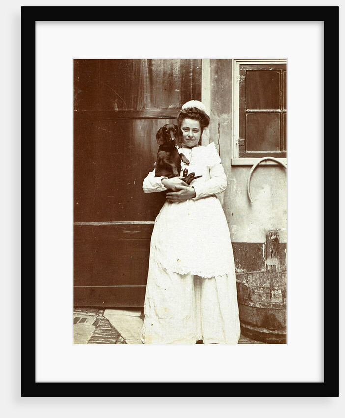 Maid with a dachshund in her arms at an outside tap by Anonymous