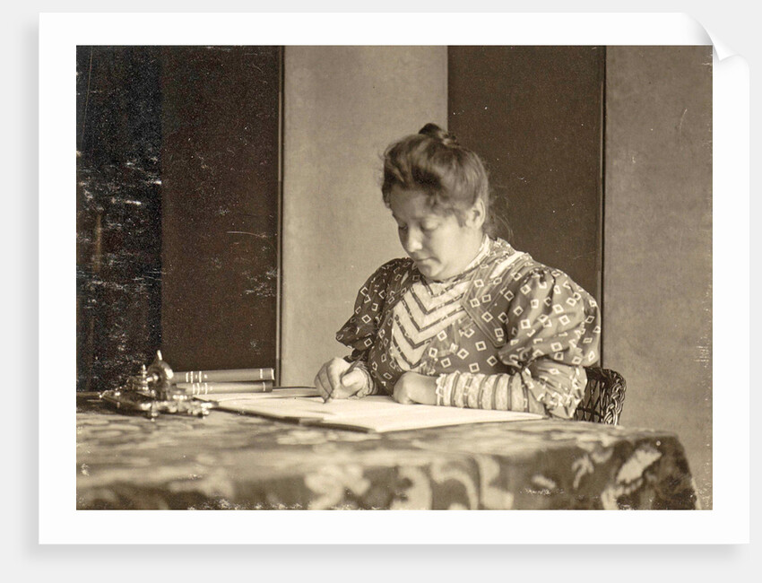 woman writing at a table by Anonymous