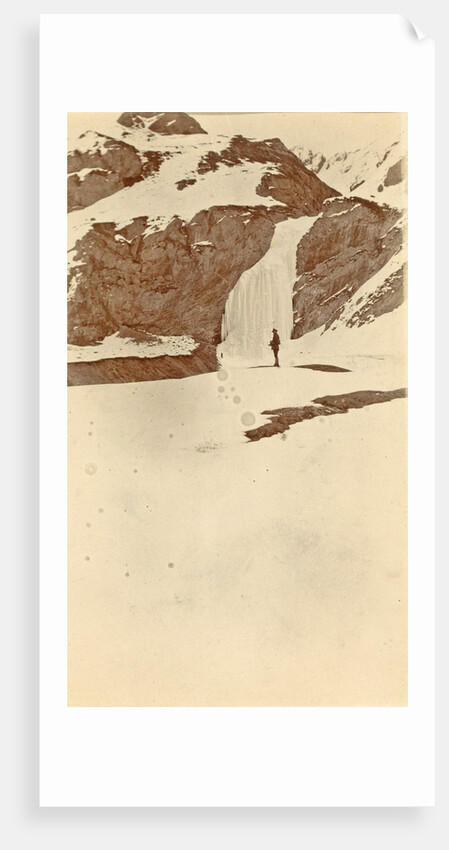 Man on the frozen waterfall Dota, Tibet by D.T. Dalton