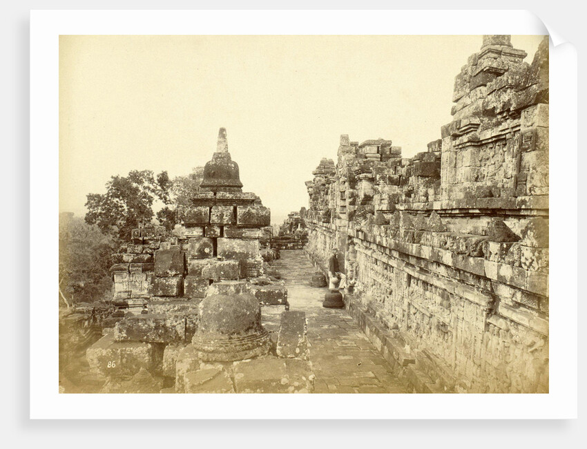Indian man on a relationship of Borobudur in Java, Indonesia by Anonymous