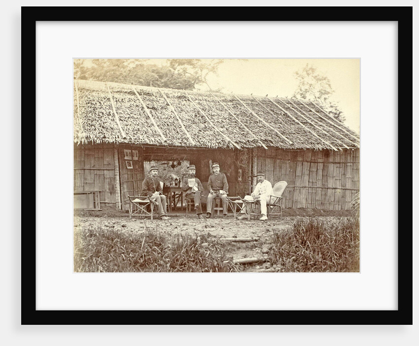 Dutch soldiers sitting in front of a wooden house in the Dutch East Indies by Anonymous