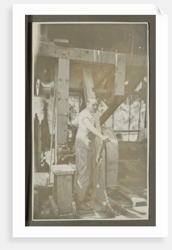 Man operating a machine with a lever by Anonymous