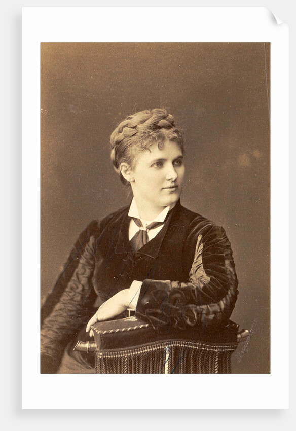 Studio Portrait of a woman sitting on a chair with curved back by Anonymous