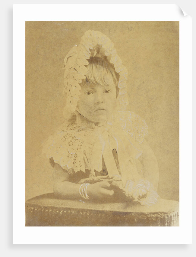 Studio Portrait of a toddler with doll and cap by Anonymous