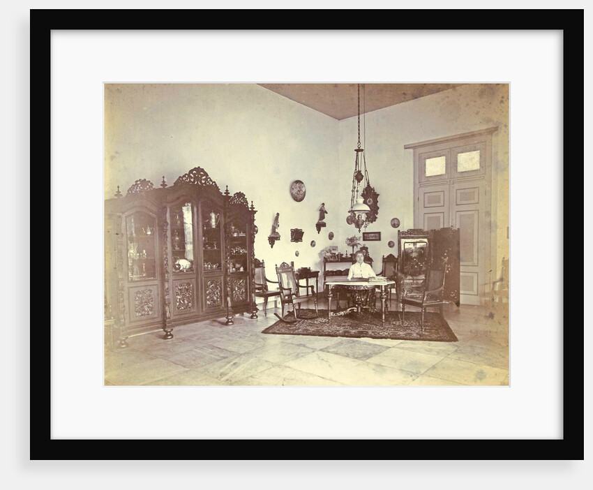 Portrait of a woman in a living room with colonial décor in Indonesia by Anonymous