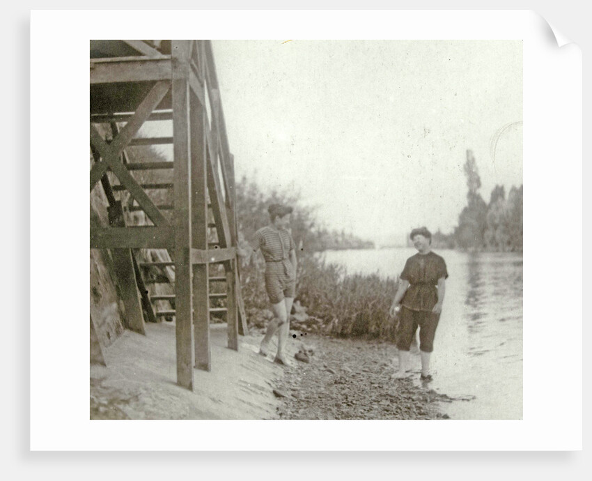 Two women at a stairway on the bank of a river or lake by Anonymous