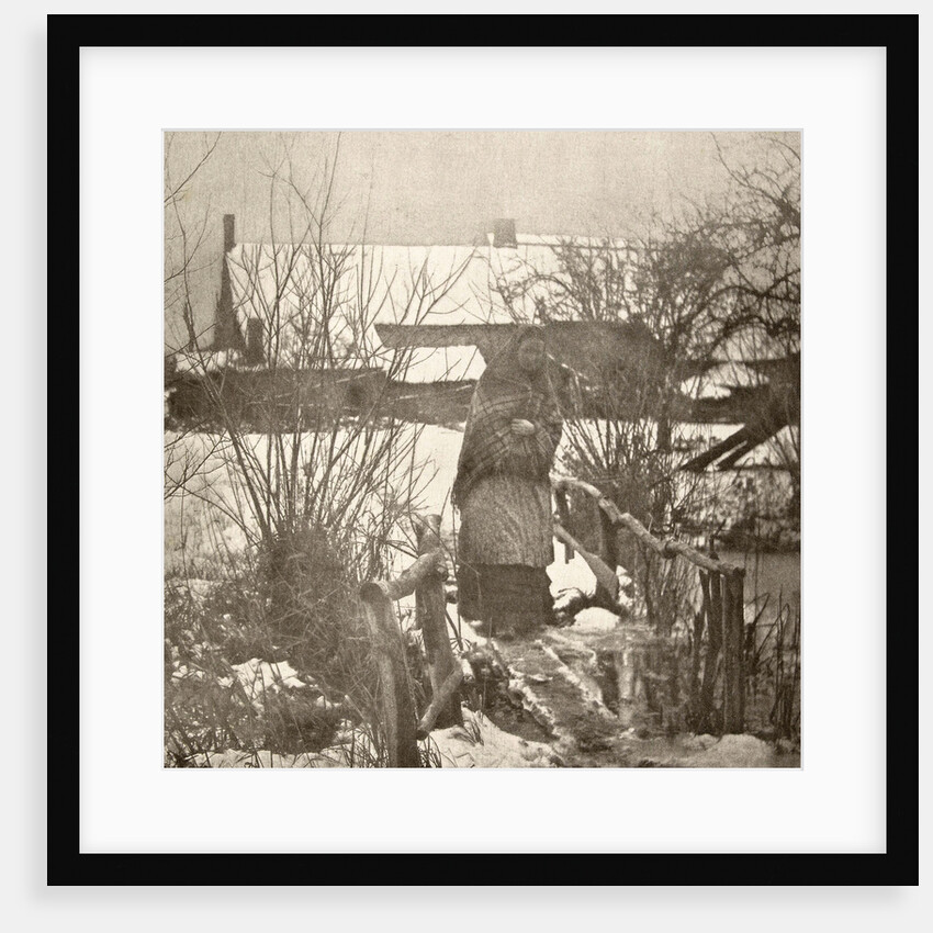 Woman on a bridge in a winter landscape by Peter Henry Emerson