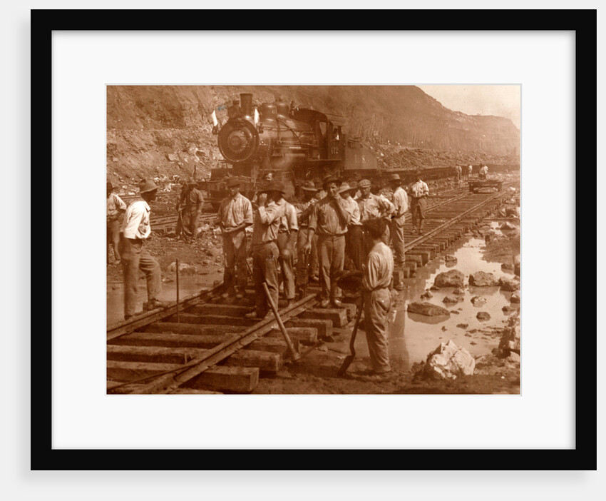 Spanish laborers at work in Culebra Cut and loaded train hauling dirt from canal, USA by Anonymous