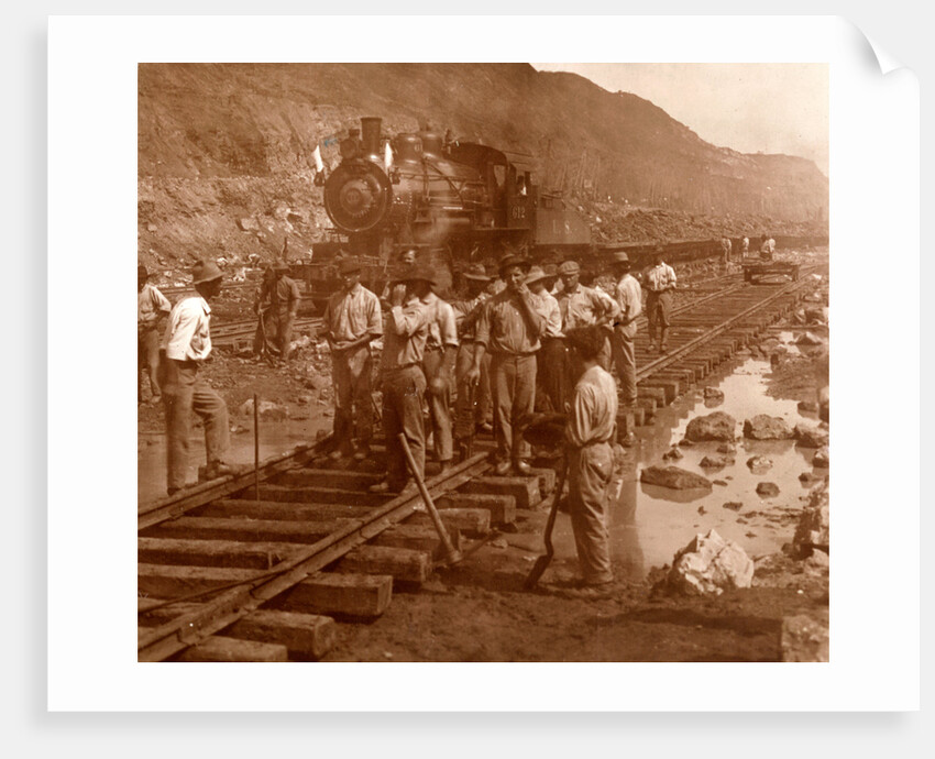 Spanish laborers at work in Culebra Cut and loaded train hauling dirt from canal, USA by Anonymous