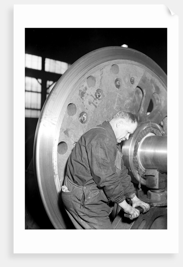Eddystone, Pennsylvania - Railroad parts. Machinist finishing axle on large driving wheels on newest type of locomotive, March 1937 by Lewis Hine