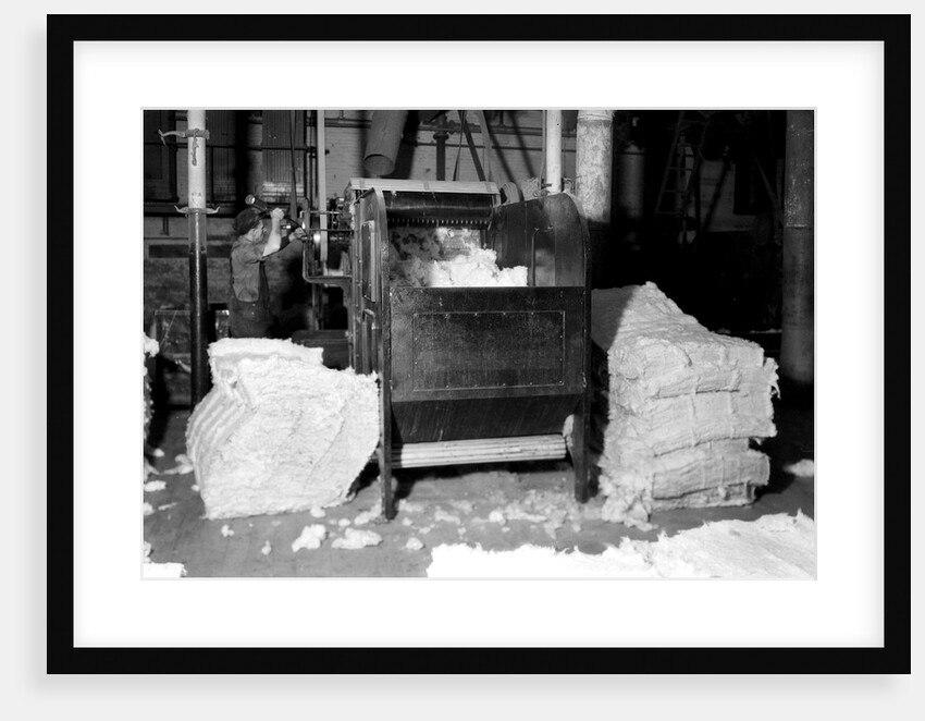 Manchester, New Hampshire - Textiles. Pacific Mills. Opener picker. by Lewis Hine