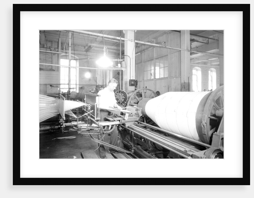Paterson, New Jersey - Textiles. Jackson Winding and Warping Company - Picture of a high speed warper, June 1937 by Lewis Hine