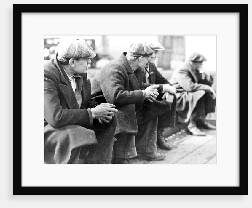 Row of men at the New York City docks out of work during the depression, 1934 by Lewis Hine