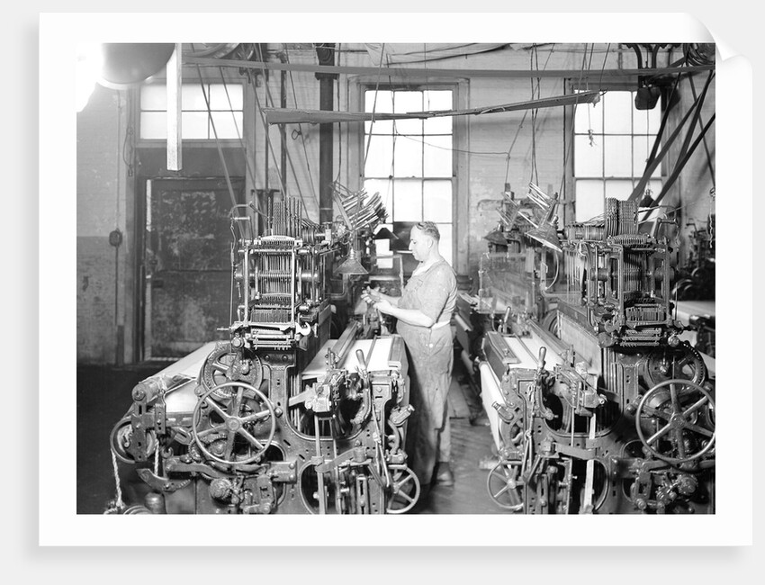 Paterson, New Jersey - Textiles. Weaver operating four-loom system. He is shown removing a used-up quill from the shuttle, 1936 by Lewis Hine