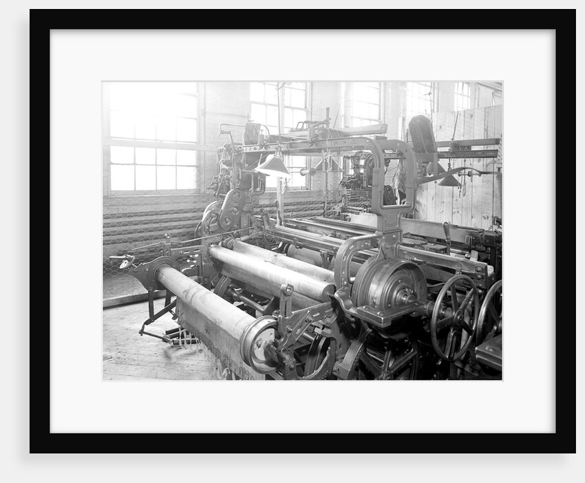 Paterson, New Jersey - Textiles. Idle quilling machines and looms in a cockroach shop. Note partition on the right and chicken-wire in the front, March 1937 by Lewis Hine